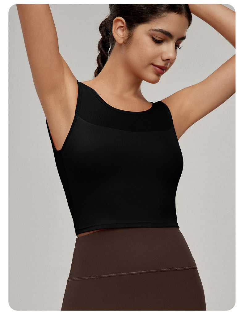 Fashionable black sleeveless crop top with sheer mesh panel, perfect for workout and ملابس