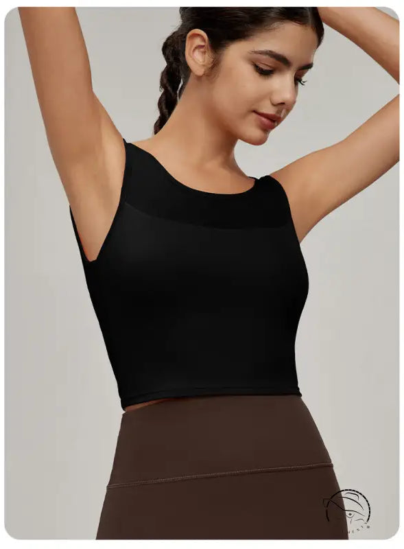 Woman in black mesh workout top and brown leggings, Langry fashion