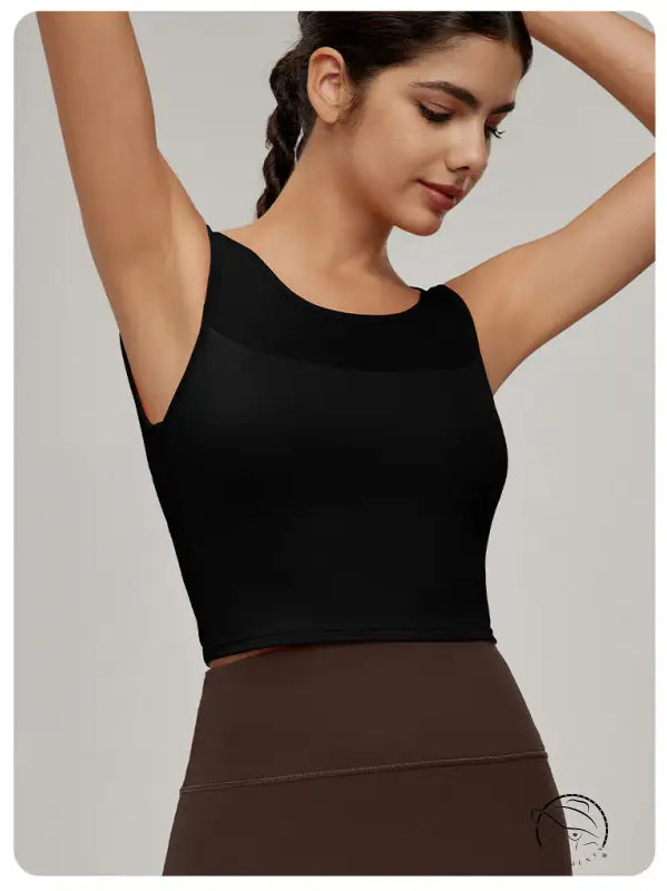 Woman in black mesh workout top and brown leggings, Langry fashion