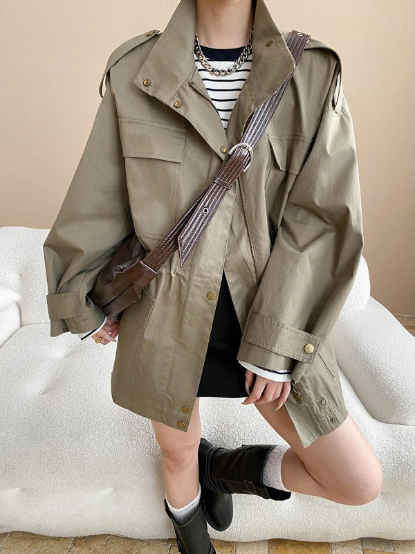 Fashionable Langry retro trench coat with black buttons, belt, striped shirt, white socks, dark boots