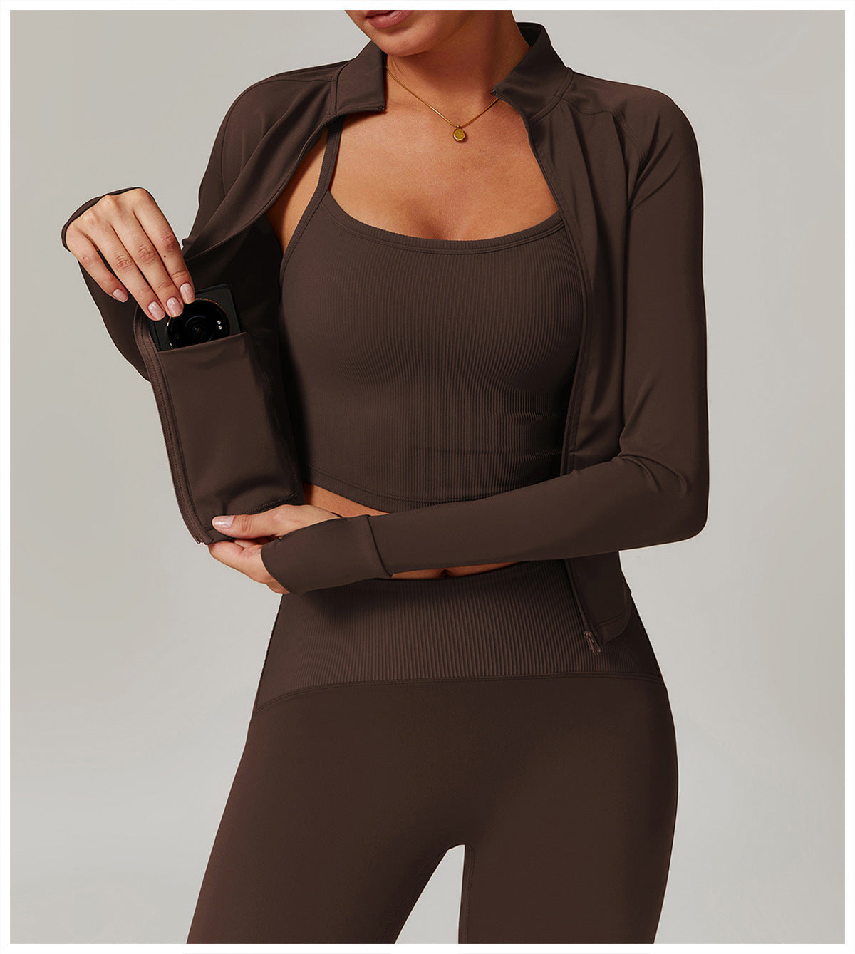 Brown athletic workout set featuring cropped tank top, sheer cover-up, and fitted leggings