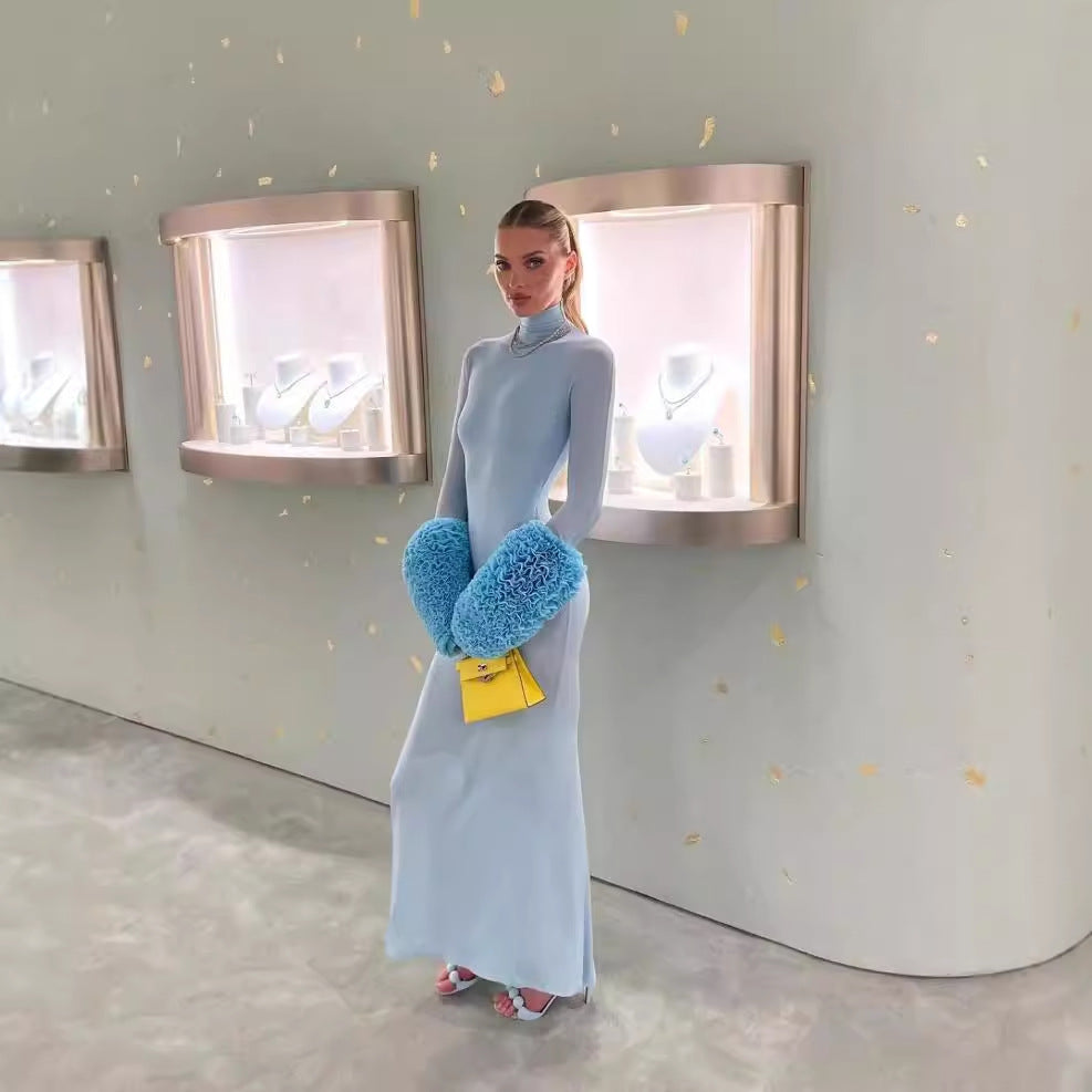 Elegant model wearing Gorgeous Light Blue Slim Fit Dress with blue furry sleeves and yellow ملابس purse