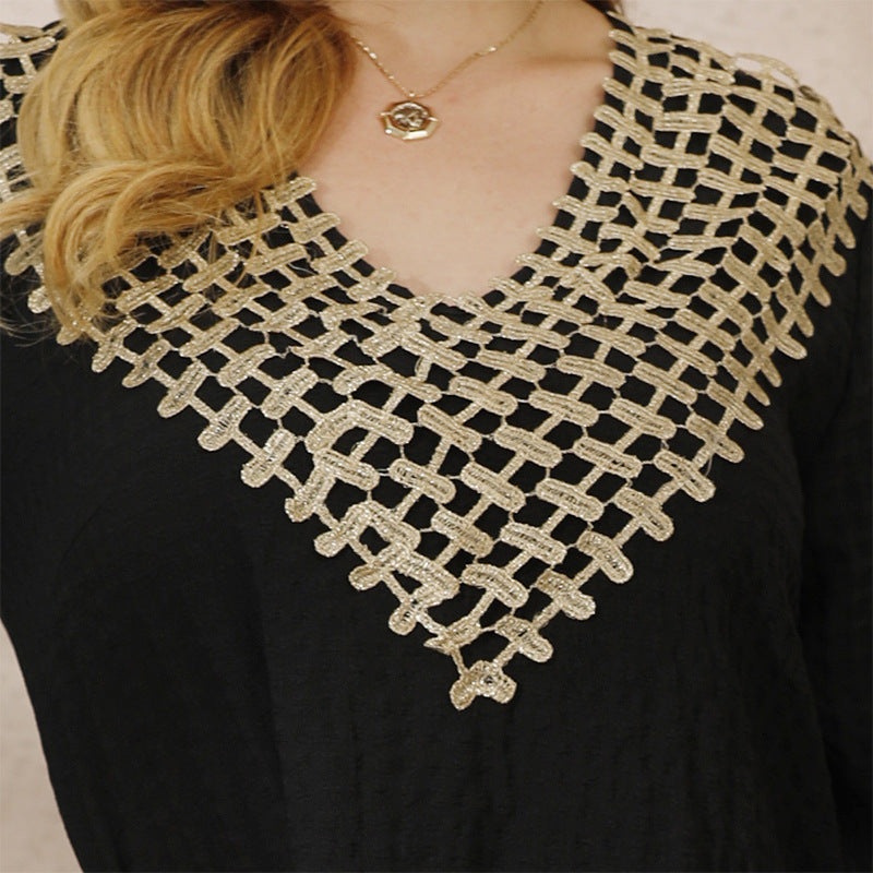 Black robe dress with flared sleeves and gold crochet lace V-neckline for winter elegance
