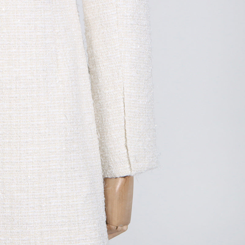 White tweed jacket sleeve showcasing elegant fashion and ملابس for sophisticated style