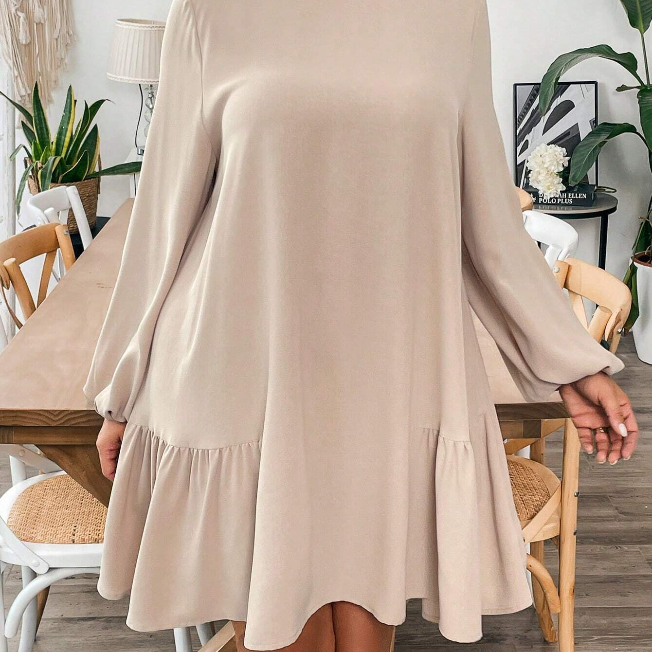Light brown long-sleeved midi dress with ruffled hem, perfect for winter fashion
