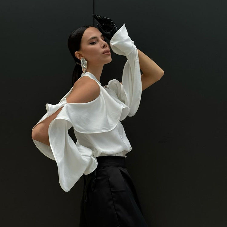 Dramatic white ruffled blouse with black skirt featuring Elegant French Design halter top fashion