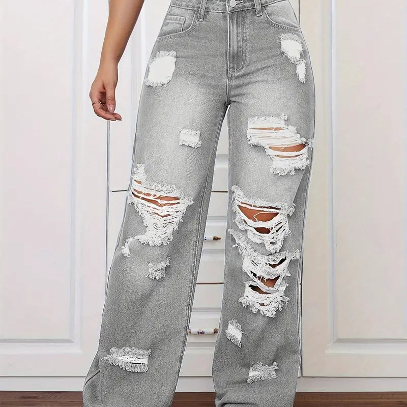 Gray distressed high-waisted langry jeans with white stitching and black sneakers