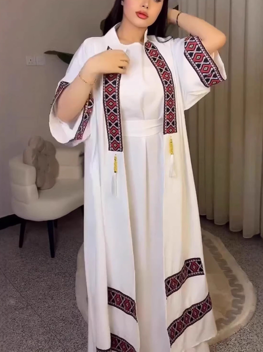 White embroidered maxi dress in langry fashion with red black geometric patterns