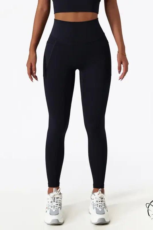 Black high-waisted yoga pants with white sneakers for langry fashion