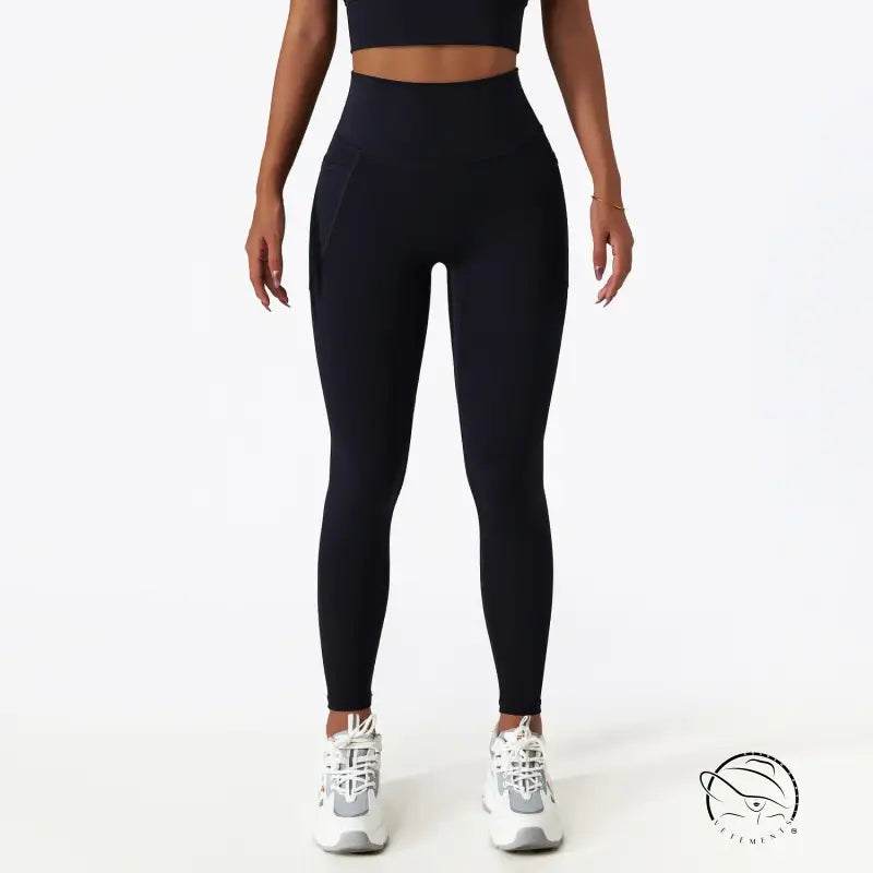 Black high-waisted yoga pants with white sneakers for langry fashion