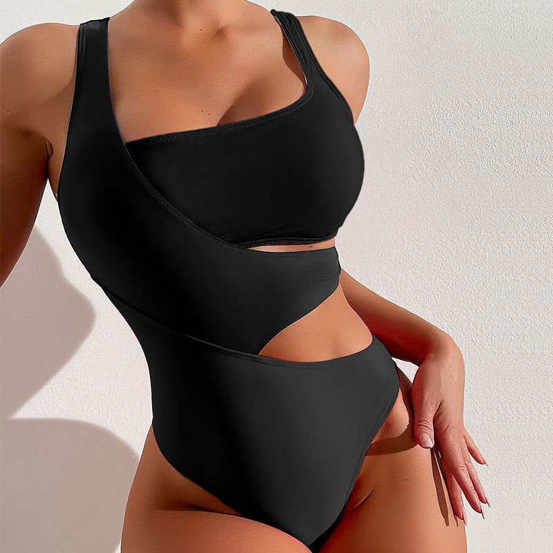 Black one-piece swimsuit with cutout high waist design for beach beauty and vacation style