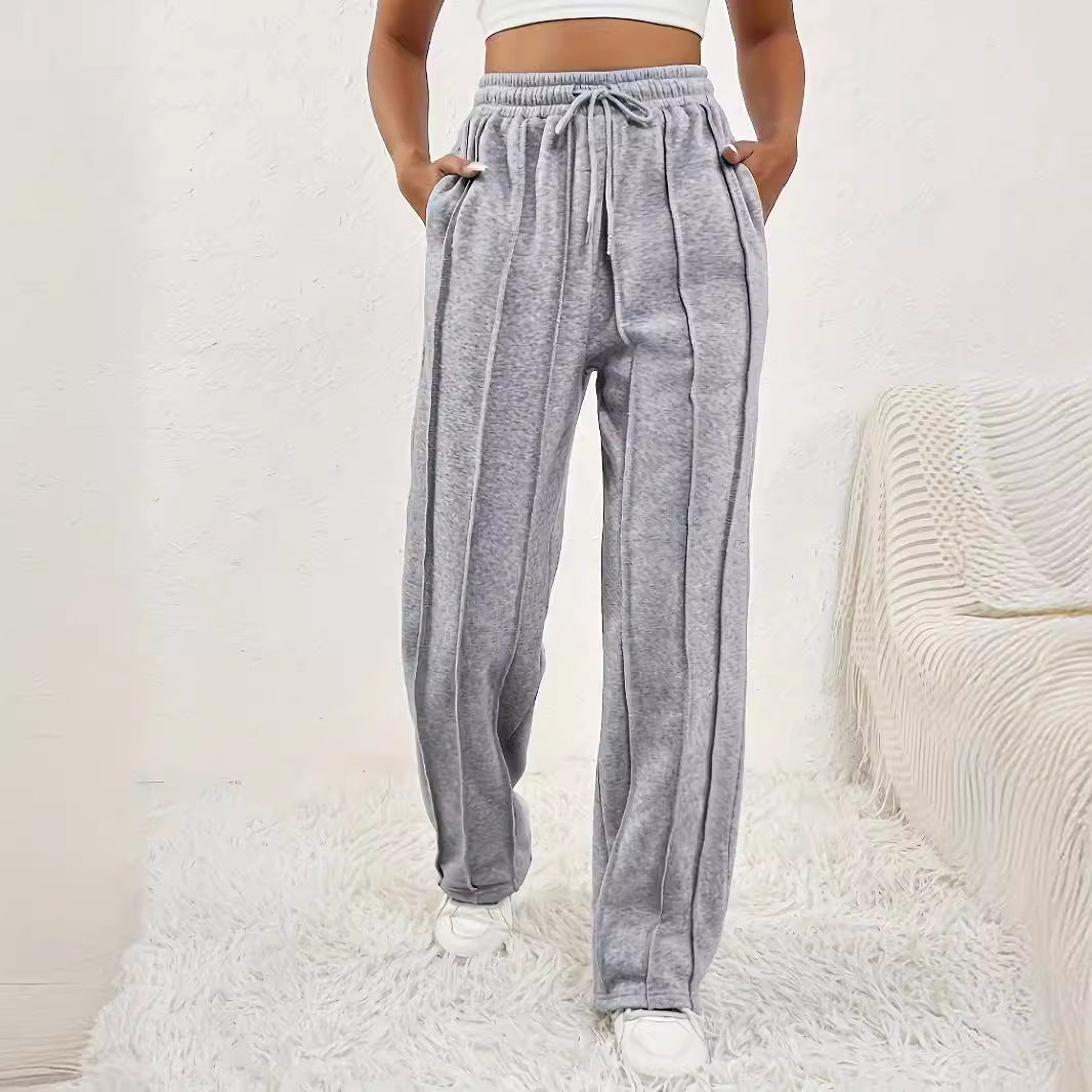 Gray wide leg drawstring sweatpants with vertical pinstripe detailing for stylish casual wear