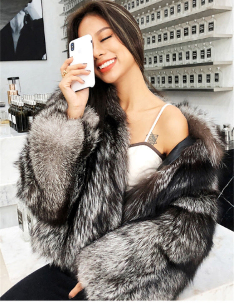 Luxurious black and silver faux fur coat showcasing plush texture for chic fashion