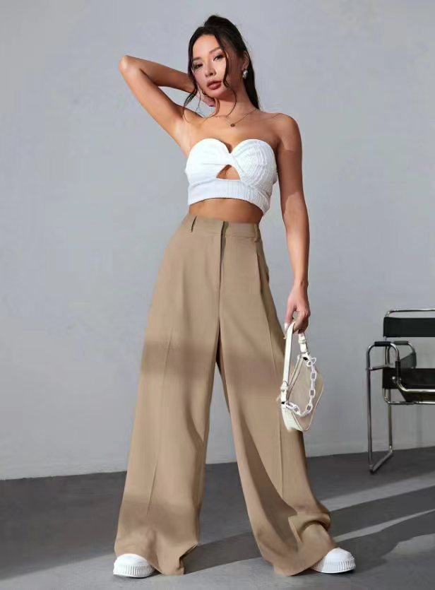 Wide leg khaki pants with white cropped bustier and sneakers for a trendy fashion look