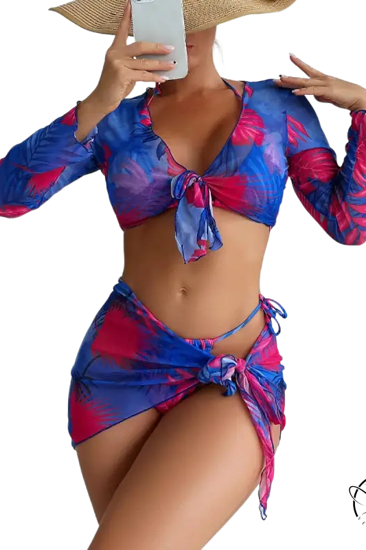 Four piece lace up swimsuit in vibrant blue and pink tropical leaves on red floral background