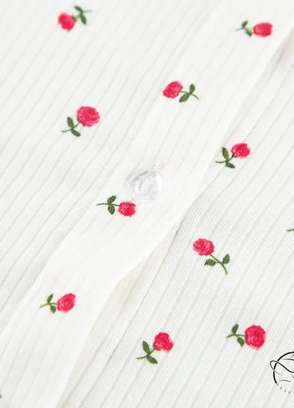 White ribbed langry cardigan with red rose embroidery and button closure