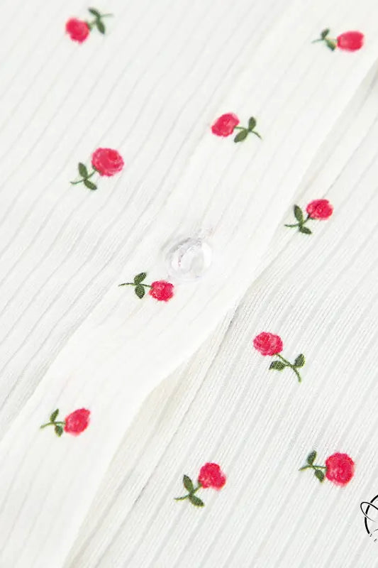 White ribbed langry cardigan with red rose embroidery and button closure