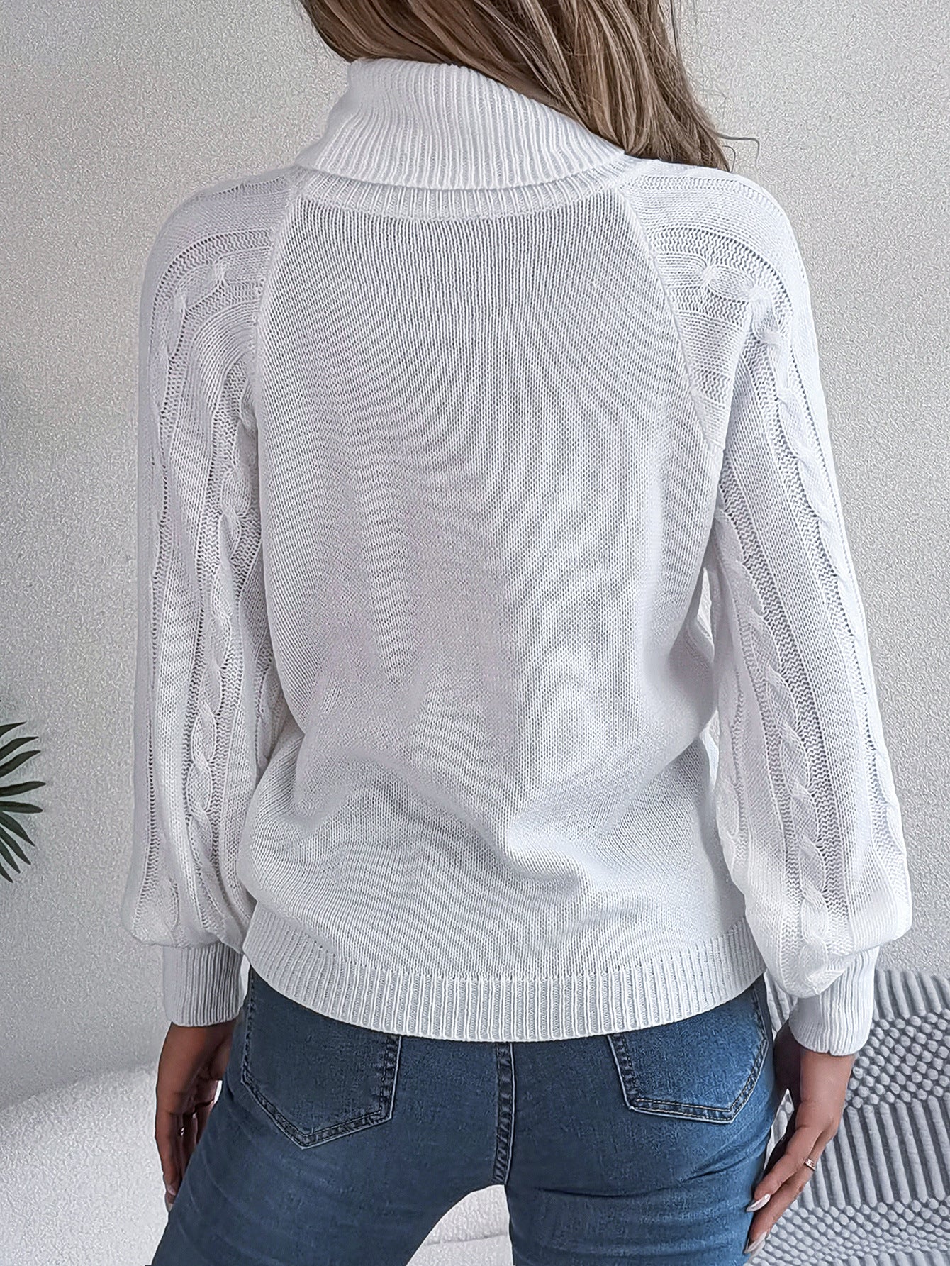 White Langry cable knit sweater with mock neck and long sleeves