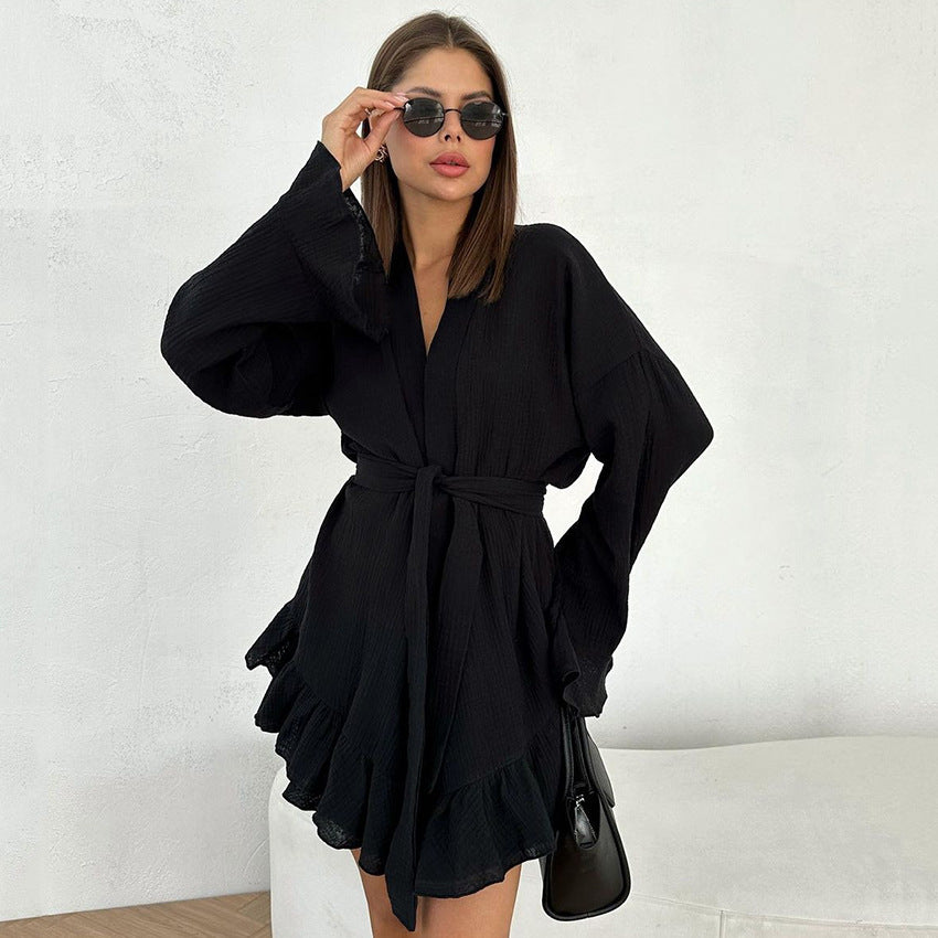 Black long-sleeved mini dress with tie-waist and ruffled hem, ideal for loose shorts ruffled pajamas