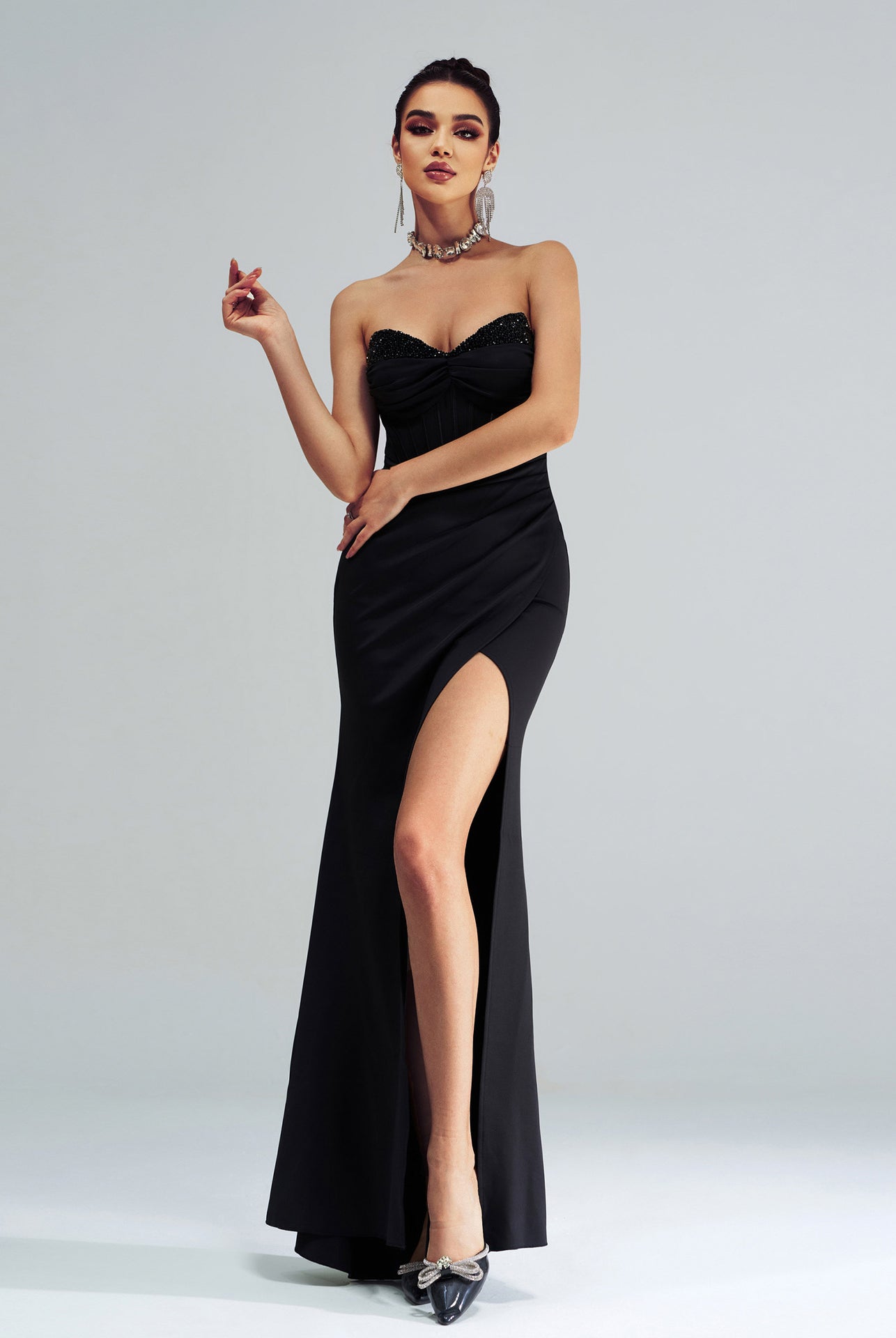 Elegant black strapless evening gown with high side slit for stylish fashion occasions