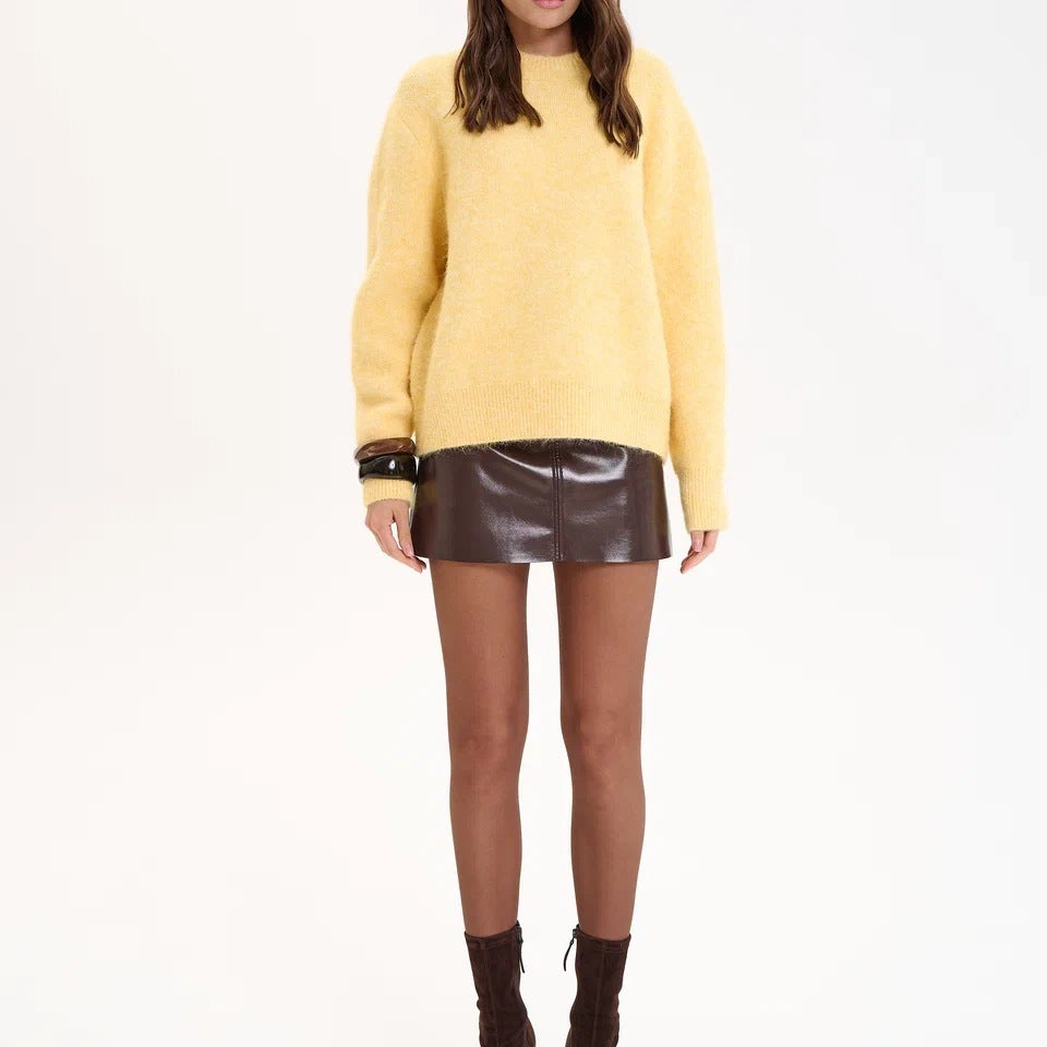 Winter wool alpaca oversized sweater with leather skirt and sunglasses