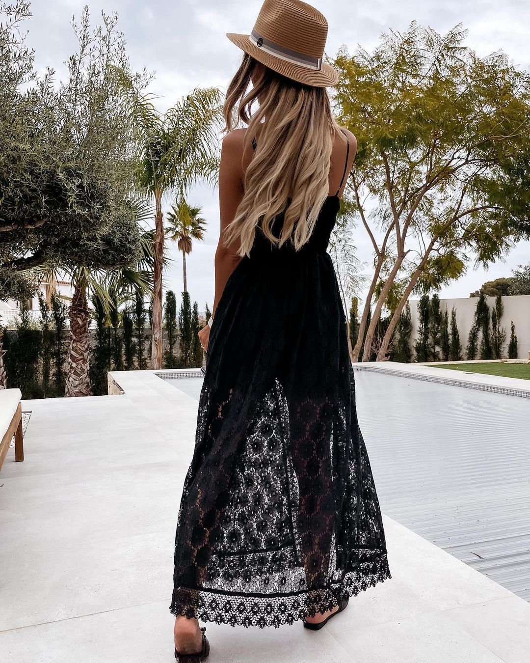 Long black lace maxi dress with brown fedora hat for elegant fashion ملابس styling