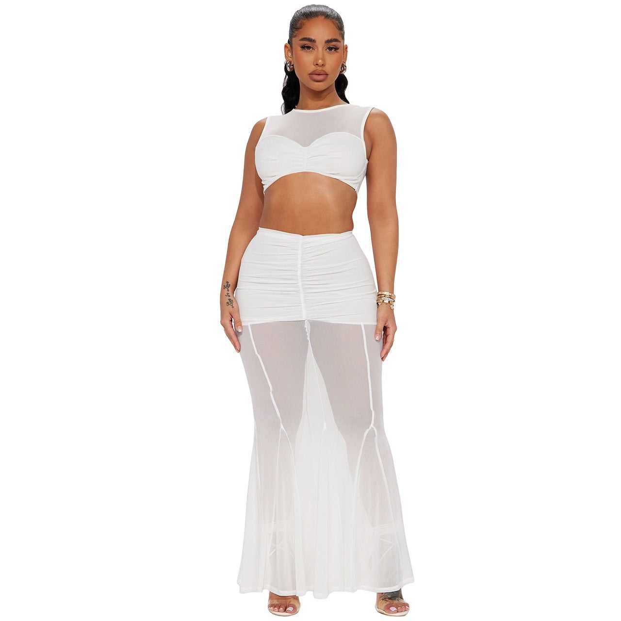 Fashionable woman in a white sheath fishtail set, mid-length skirt and top ensemble