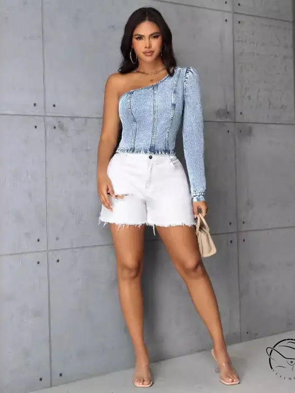 Women slim denim top with light-wash one-shoulder puff sleeve and white distressed shorts