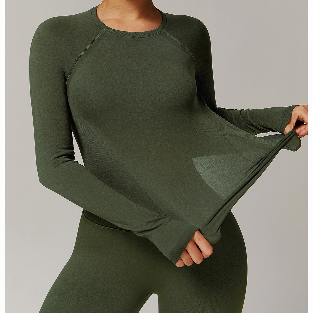 Olive green long sleeve athletic shirt and leggings for fashionable running sports