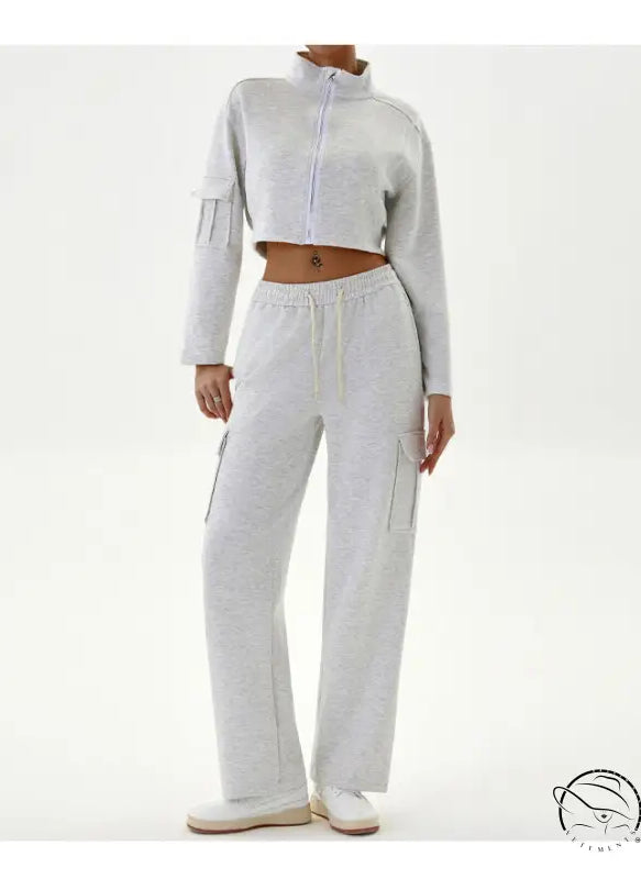 Woman in gray cropped jacket and cargo pants, winter workwear casual sports set