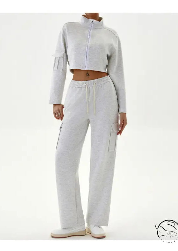 Woman in gray cropped jacket and cargo pants, winter workwear casual sports set