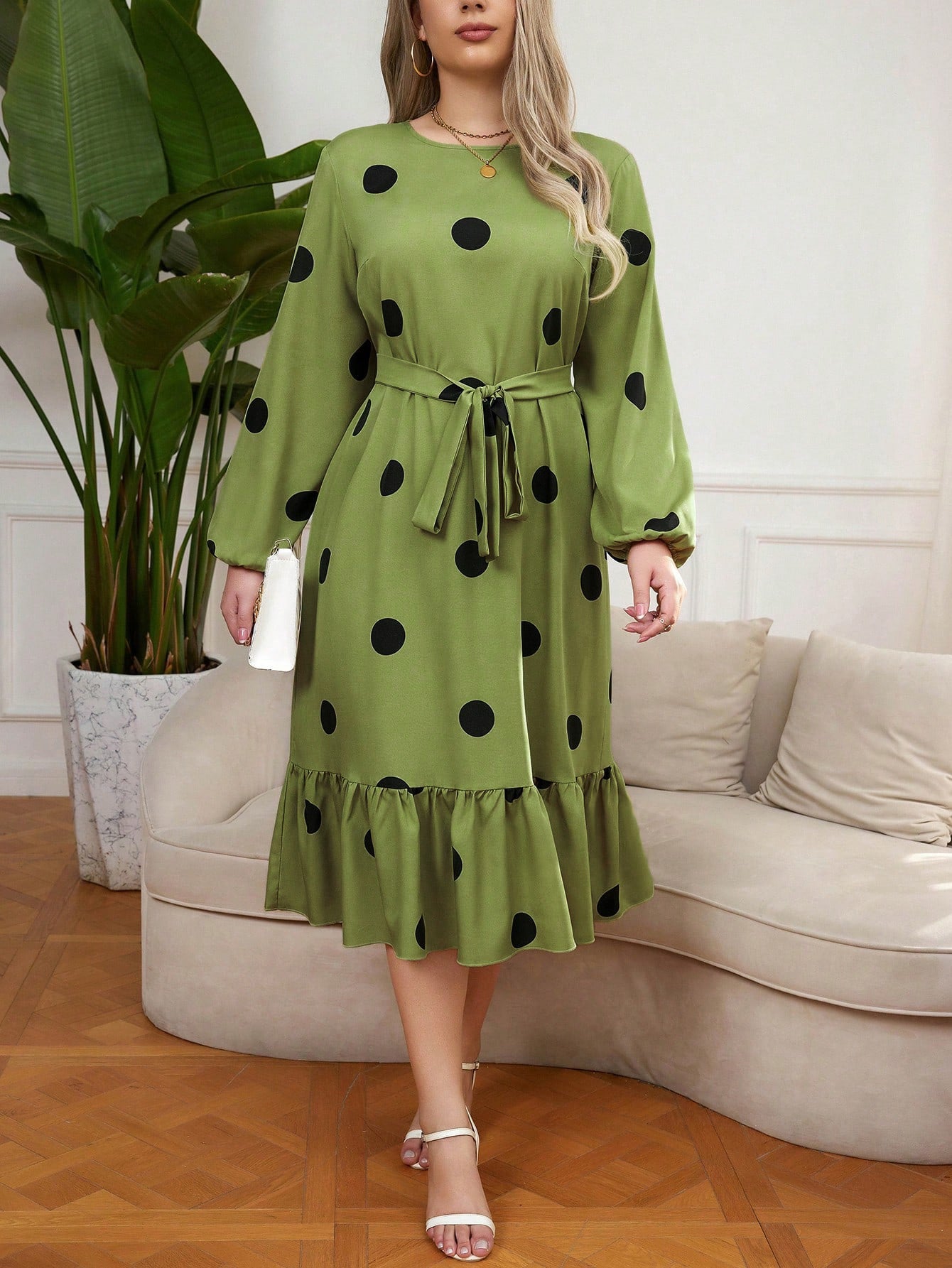 Green midi Lotus Leaf Dress with black polka dots and ruffled hem for elegant style