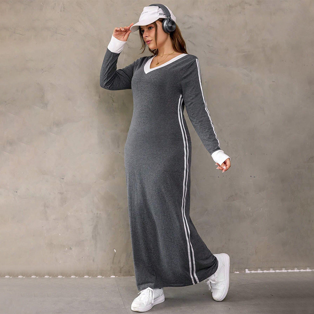 Gray long-sleeved maxi dress with white stripes, perfect for winter fashion