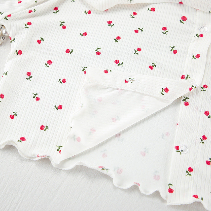 White women’s button-up shirt with tiny red rose print and lettuce hem for casual fashion and ملابس
