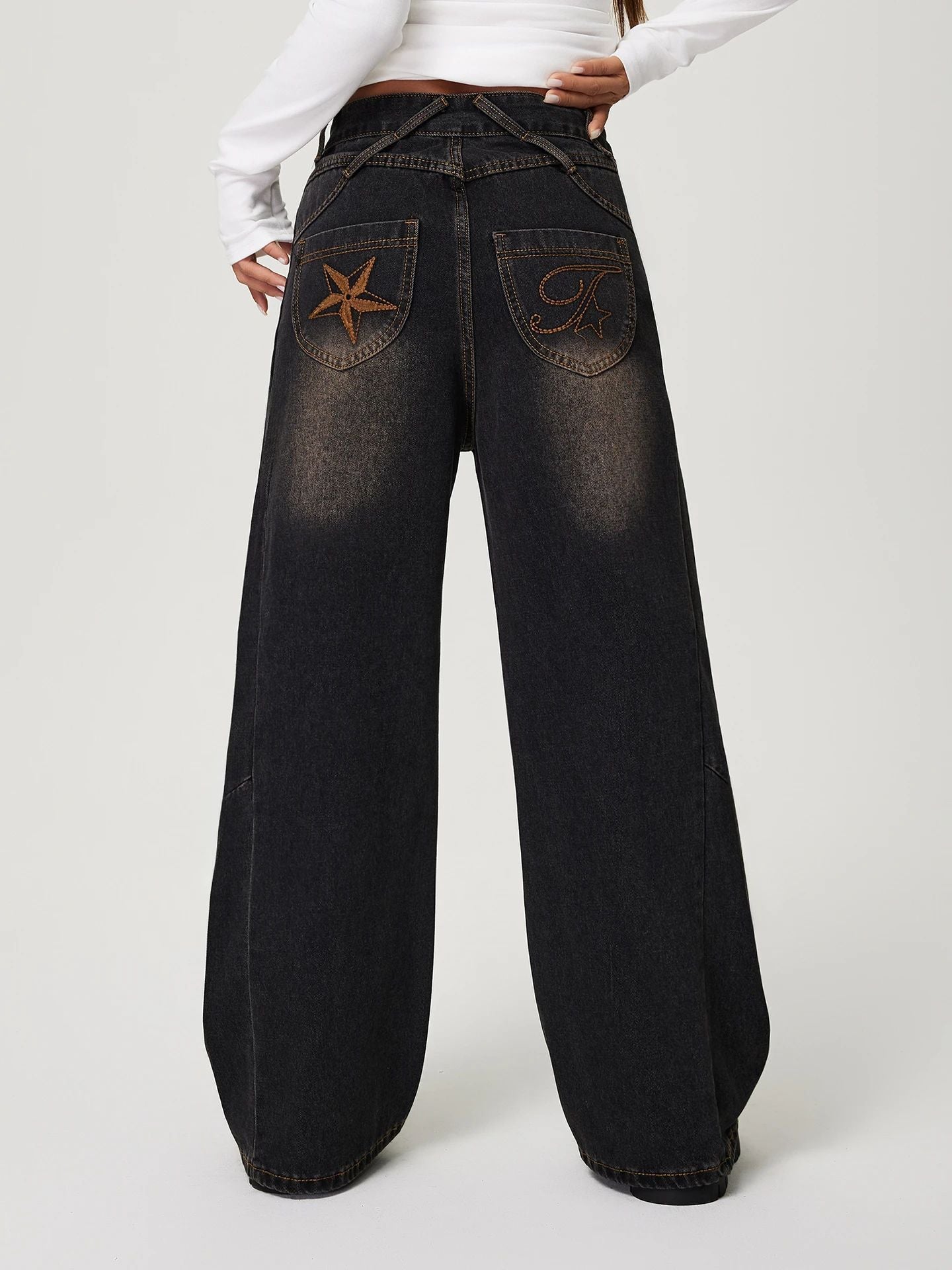 Wide-leg dark denim jeans with star pocket embellishment in stylish fashion by Langry
