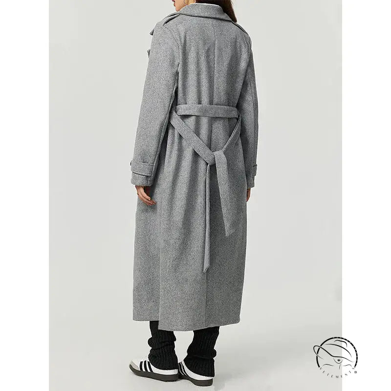 Long gray wool trench coat with double-breasted buttons and belt, cozy woolen fashion outerwear