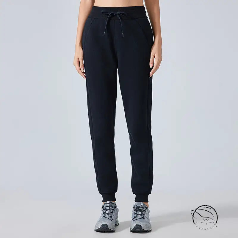 Black casual loose tapered sports pants with drawstring waist and elastic cuffs