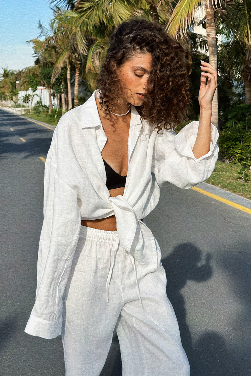 Woman in white linen outfit showcasing Cotton Shirt Trousers Casual Sets for fashion lovers