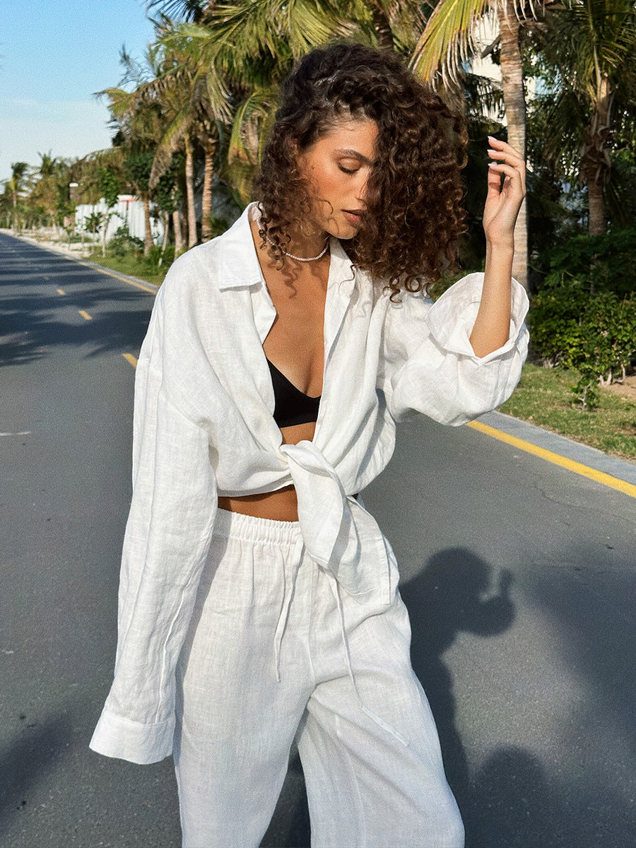 Woman in white linen outfit showcasing Cotton Shirt Trousers Casual Sets for fashion lovers