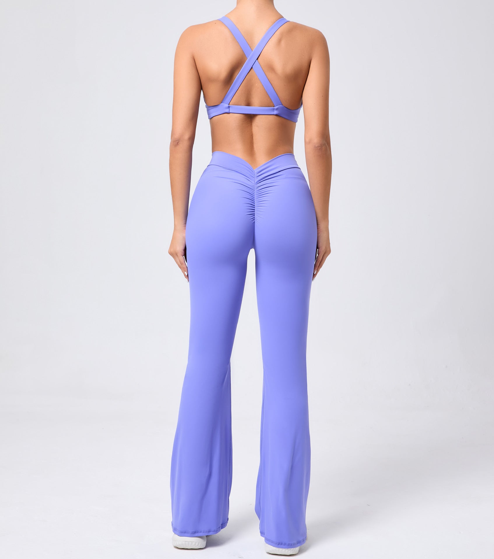 Peach hip raise tight brushed yoga jumpsuit with lavender crisscross backless design
