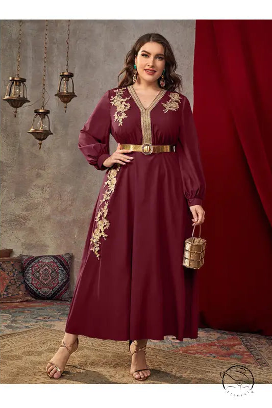 Maroon long-sleeved A-line dress with gold embroidery and belt