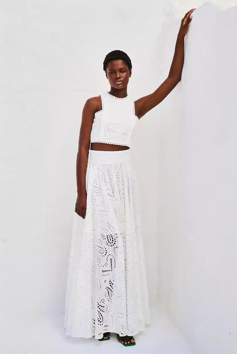 Woman in white eyelet crop top and maxi skirt, showcasing Langry fashion ملابس