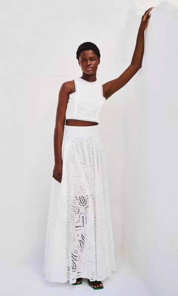 Woman in white eyelet crop top and maxi skirt, showcasing Langry fashion ملابس