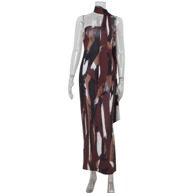 Long sleeveless maxi dress with abstract brown, white, and burgundy print pattern