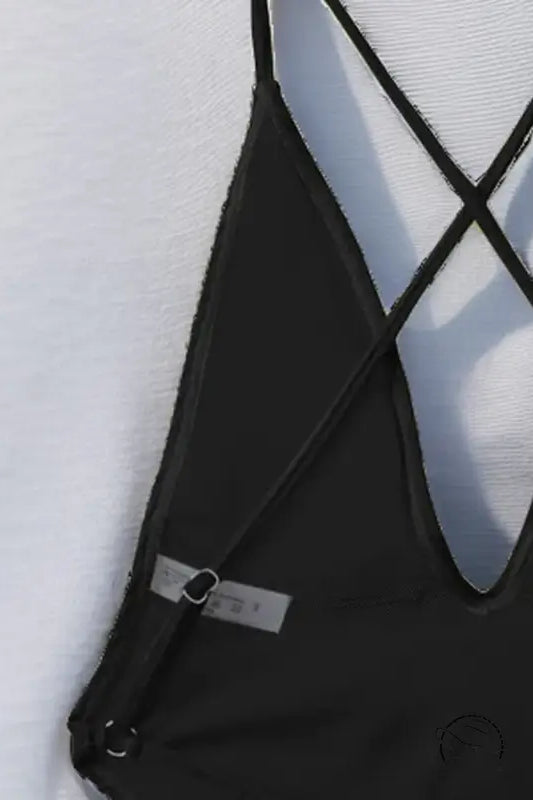 Black strappy one piece bikini top with crisscross back detail