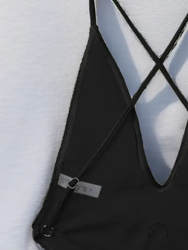 Black strappy one piece bikini top with crisscross back detail