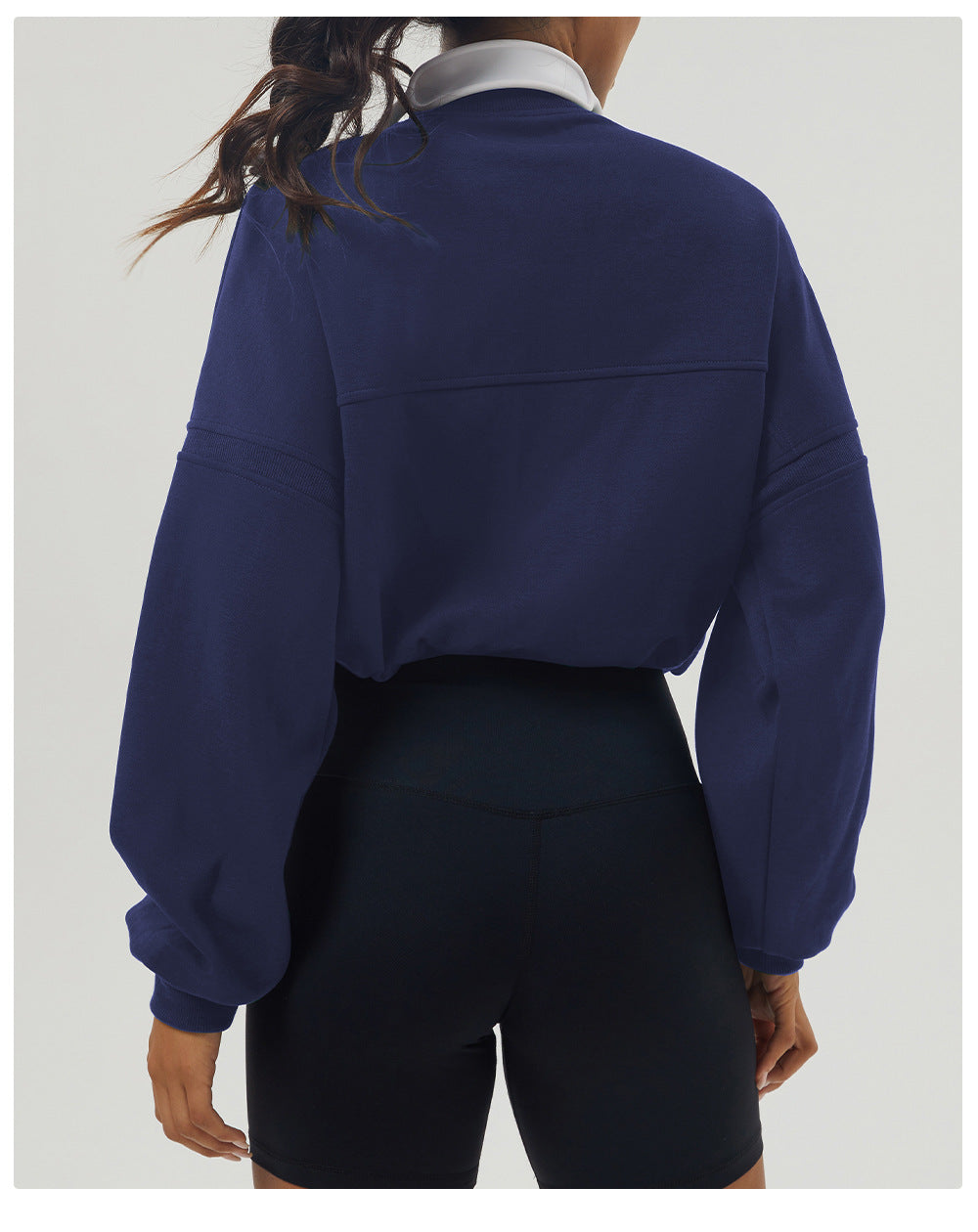 Navy blue rugby shirt and black shorts in fashionable long sleeve fitness attire