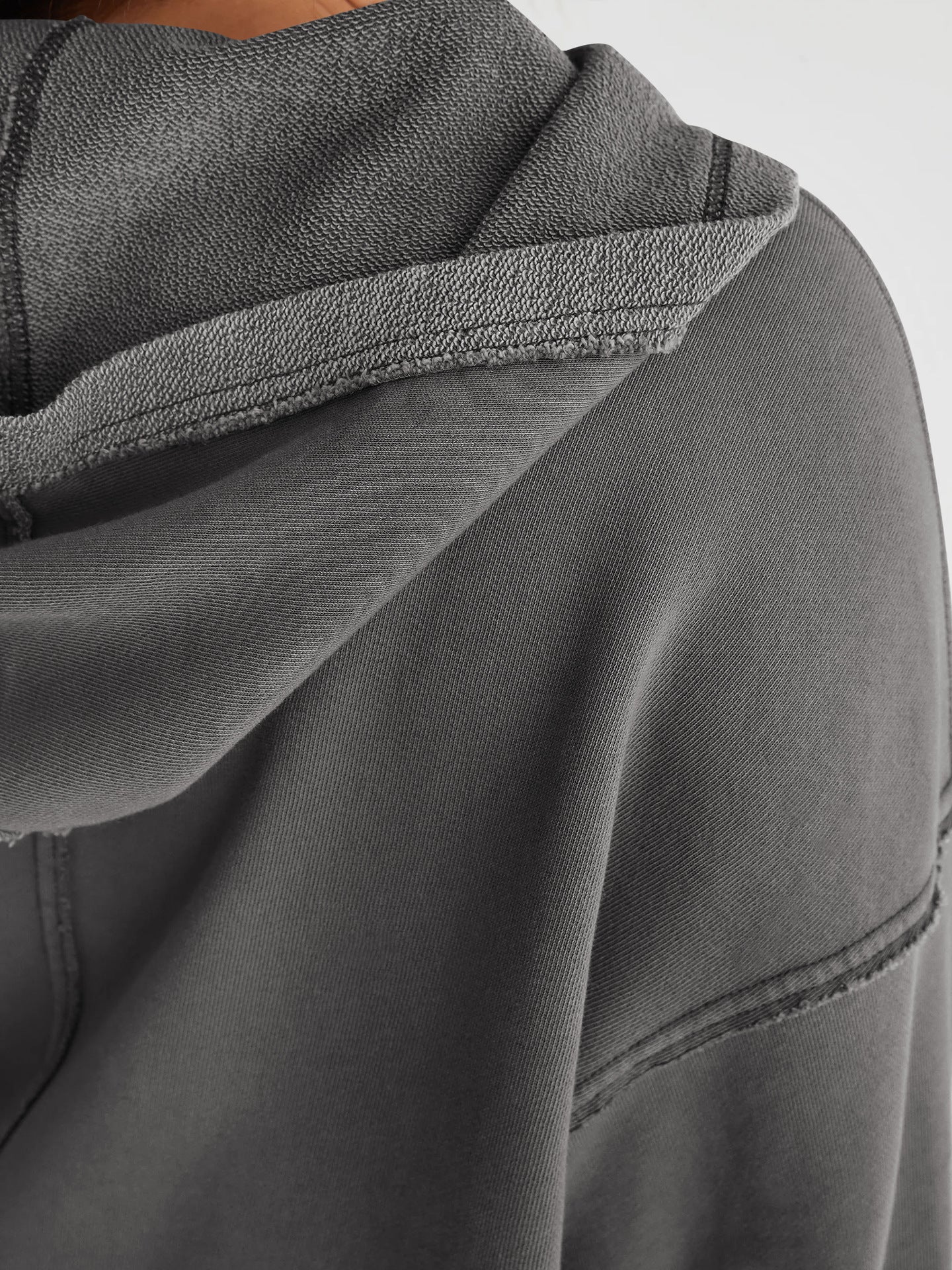 Gray hooded sweatshirt showcasing fabric texture and seam details for langry fashion ملابس