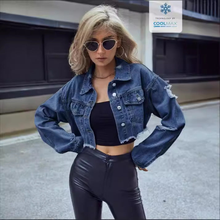 Woman wearing a casual matching denim short coat with black crop top and leather pants