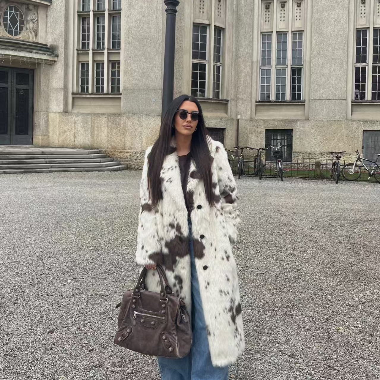 Cozy faux fur long coat in cow print with brown and white spots